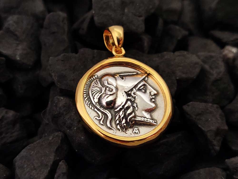 A Greek silver pendant depicting goddess Athena with gold plated finish and measuring 21mm - 0.81 inches in diameter. Hallmark 925 and made in Greece. Free shipping included.