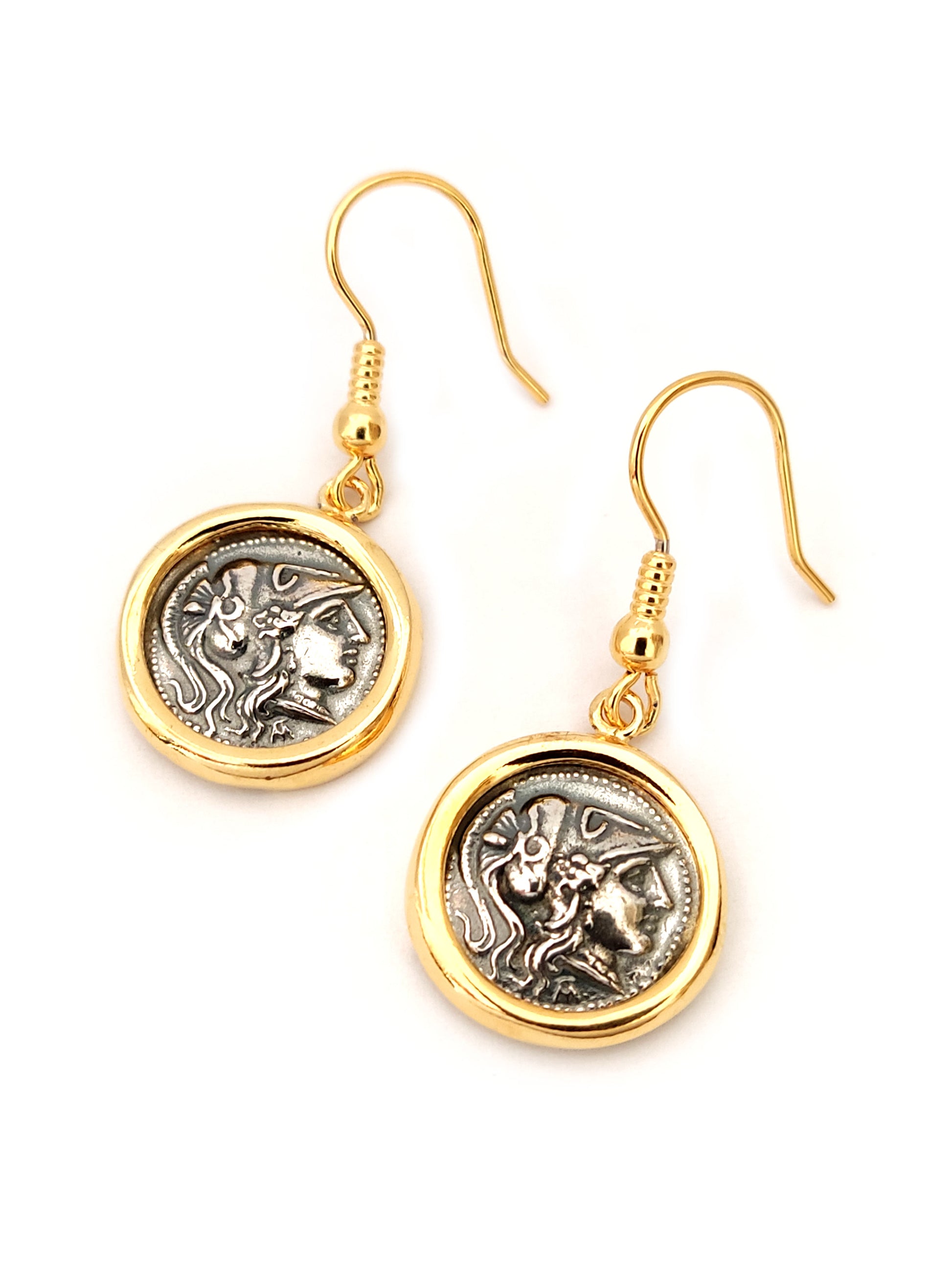 Greek silver dangle earrings with goddess Athena and gold plated finish on white background.