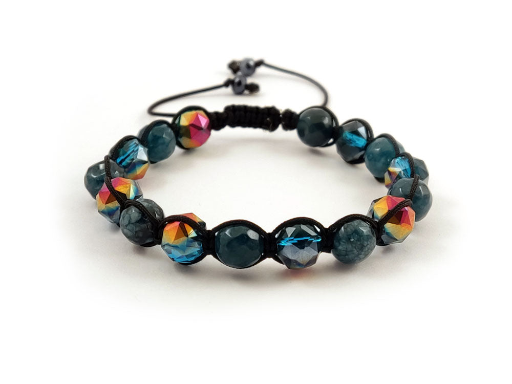 Close-up of macrame bracelet with jade and iris green crystals