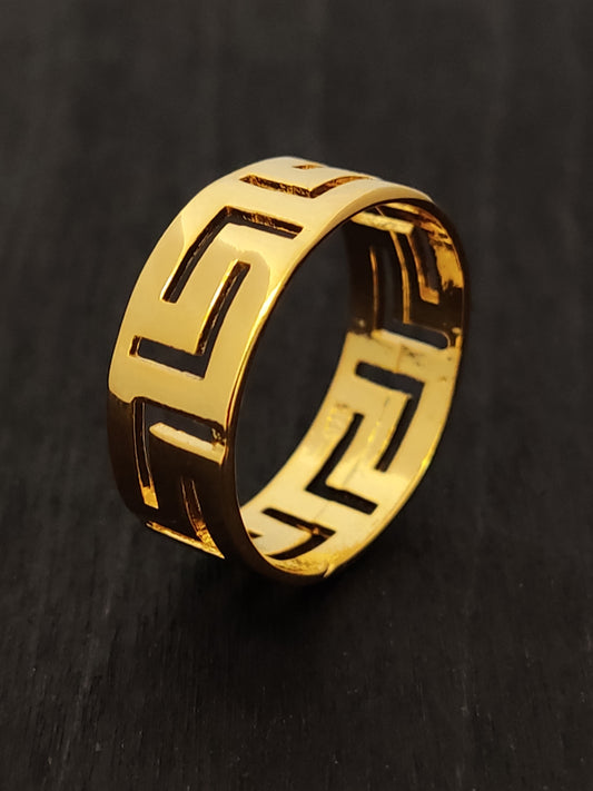 Greek key silver ring with the meander design with gold finish on black background. This ring is part of the Sirioti Jewelry collection.