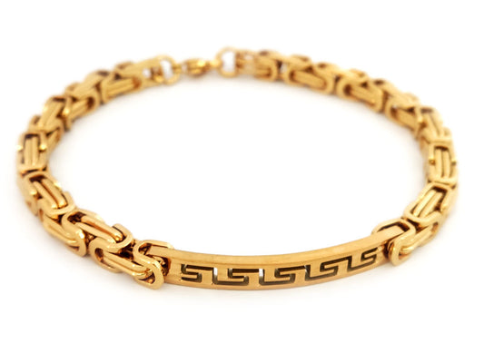 Gold-plated stainless steel Greek Key bracelet on white background