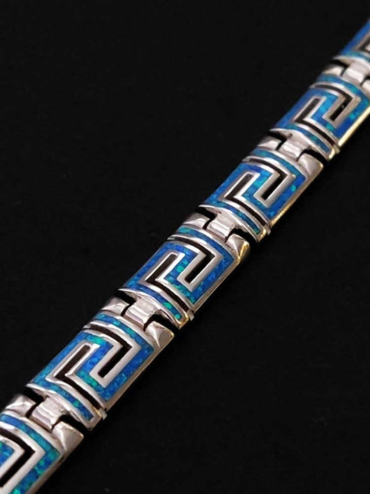 Close-up of a stunning Sterling Silver 925 Fire Rainbow Blue Opal Bracelet with Ancient Greek Eternity Key Meander Modern Design.