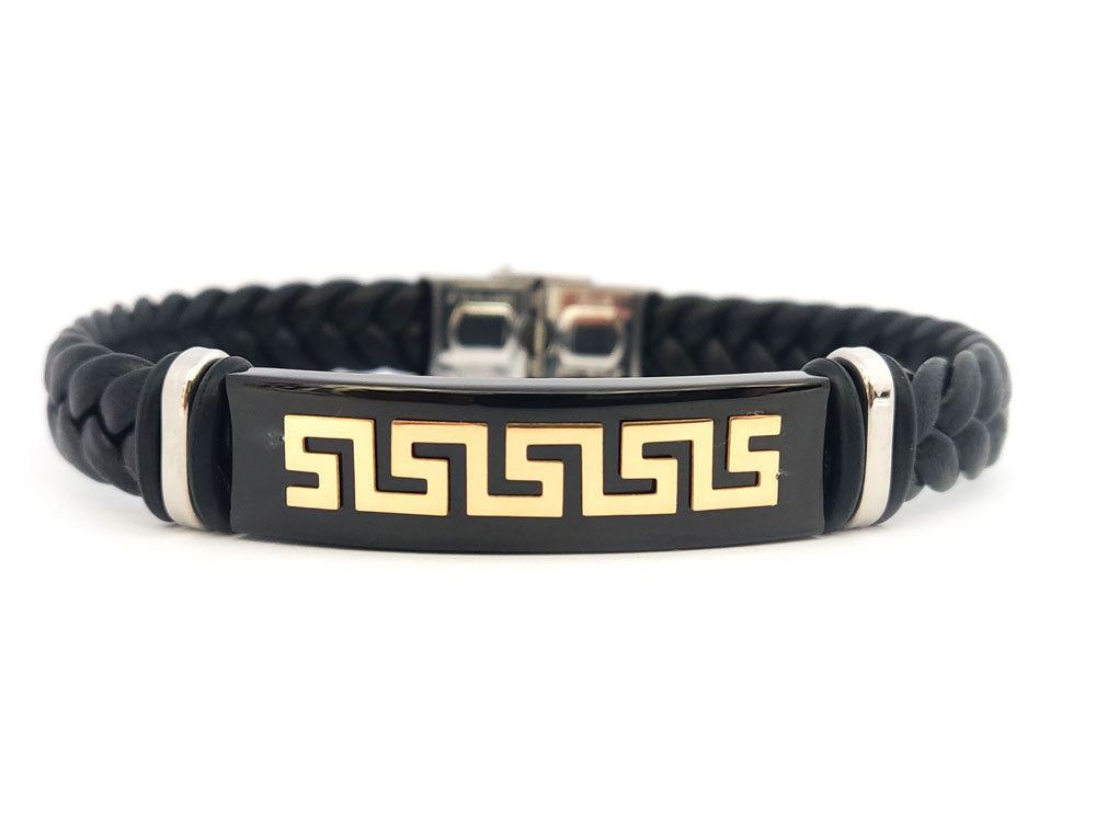 “Gold-plated Greek Key bracelet made of stainless steel and leather, displayed on a white background”

