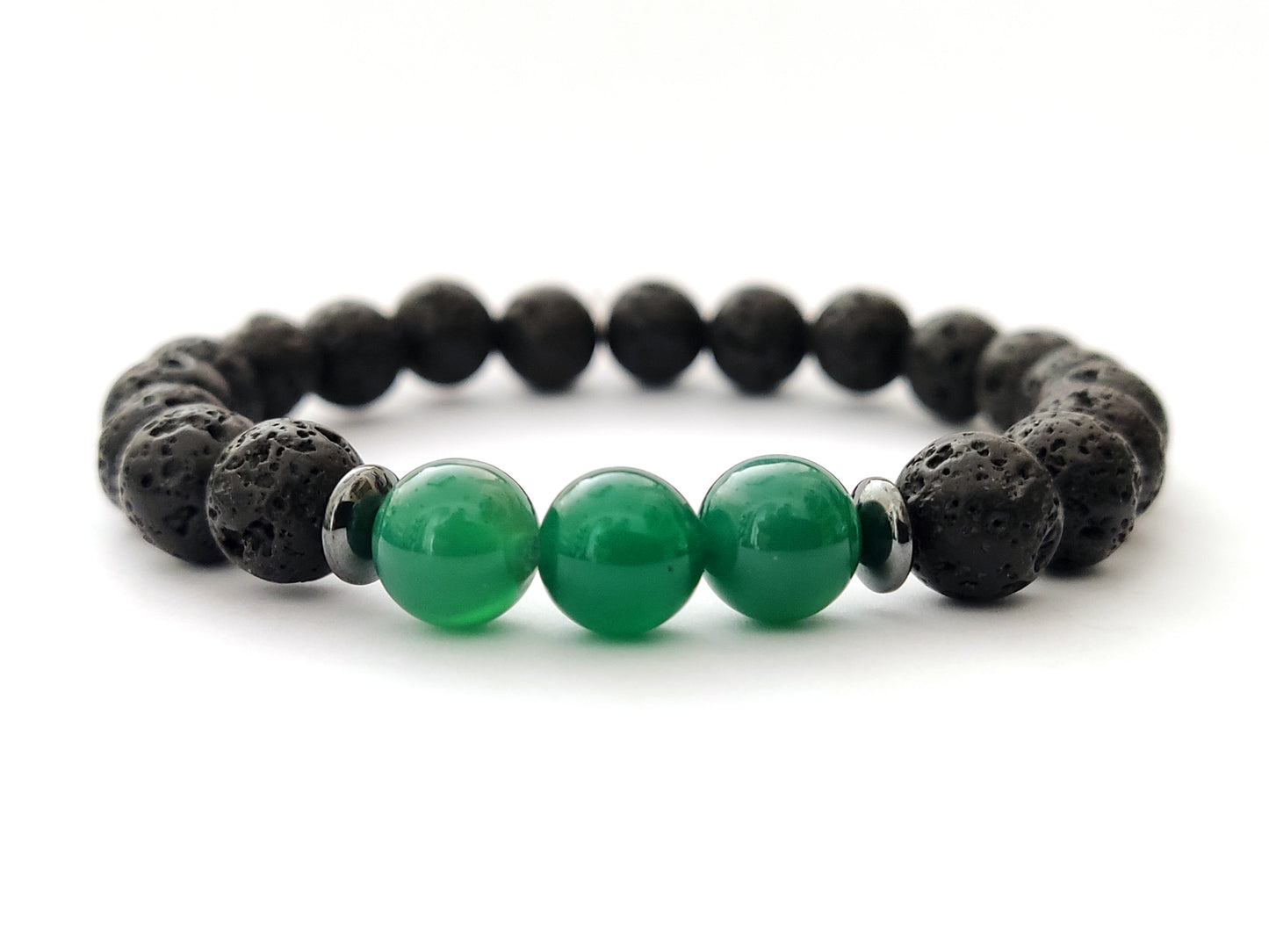 Greek volcanic lava bracelet with 3 pieces of green agate in the middle measuring 8mm on white background.