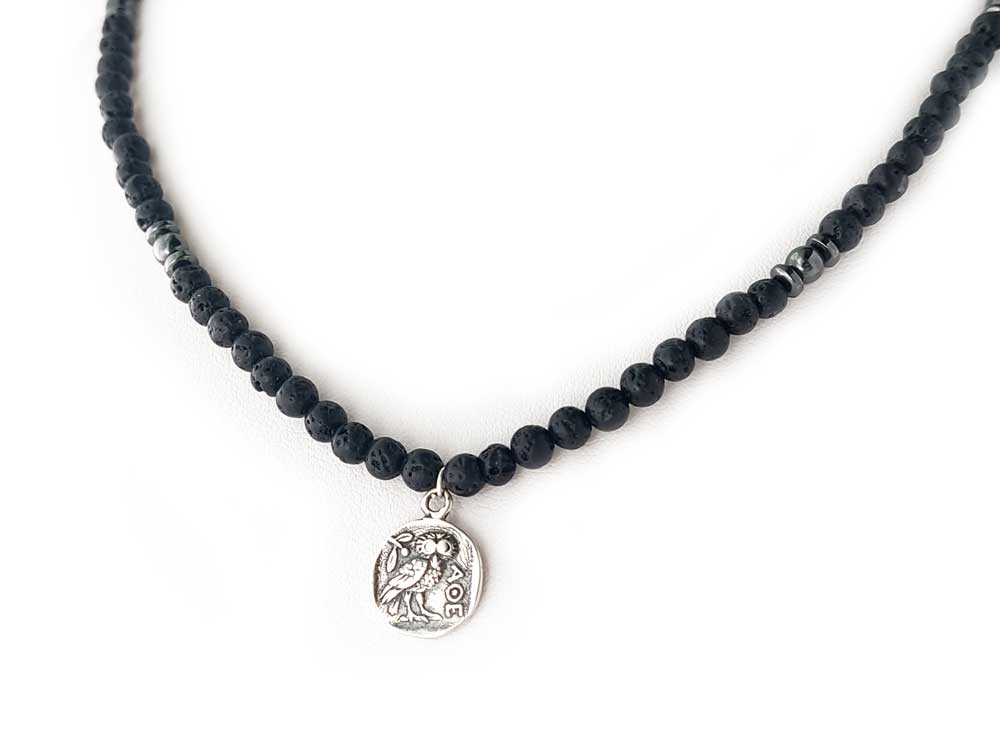 Greek necklace made with silver and lava stones. The lava stones measure 4mm and the coin silver pendant 13mm and depicts an ancient Greek tetradrachm coin with goddess Athena and her symbol the owl.