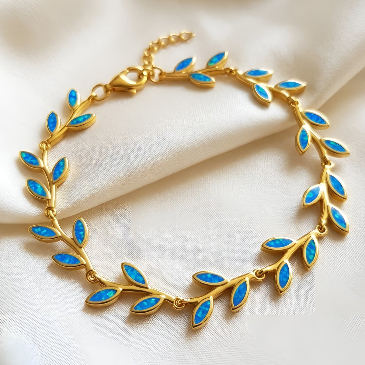 Gold-plated sterling silver bracelet with Greek olive leaf design and blue opal stones
