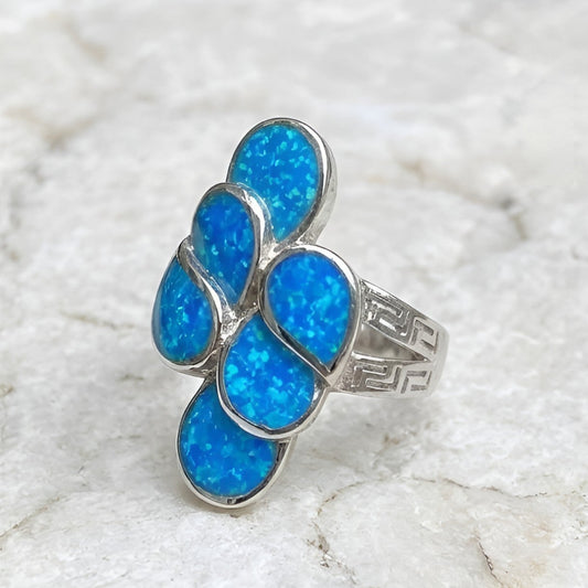 Greek meander pattern statement ring with blue opal details