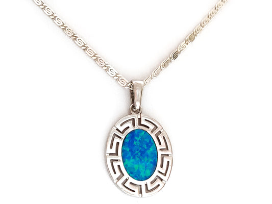 This exquisite jewelry piece features a Sterling Silver 925 pendant adorned with a stunning Blue Opal Stone, showcasing an intricate Greek Key Infinity Design. The Silver Pendant measures 23 x 20 mm (0.89 x 0.78 inches), while the accompanying Silver Greek Infinity Chain boasts a width of 2 mm (0.18 inches) and is secured with a Silver Clasp. It bears the hallmark '925' denoting its purity and is proudly crafted in Greece. Enjoy the added benefit of free shipping for this elegant accessory.