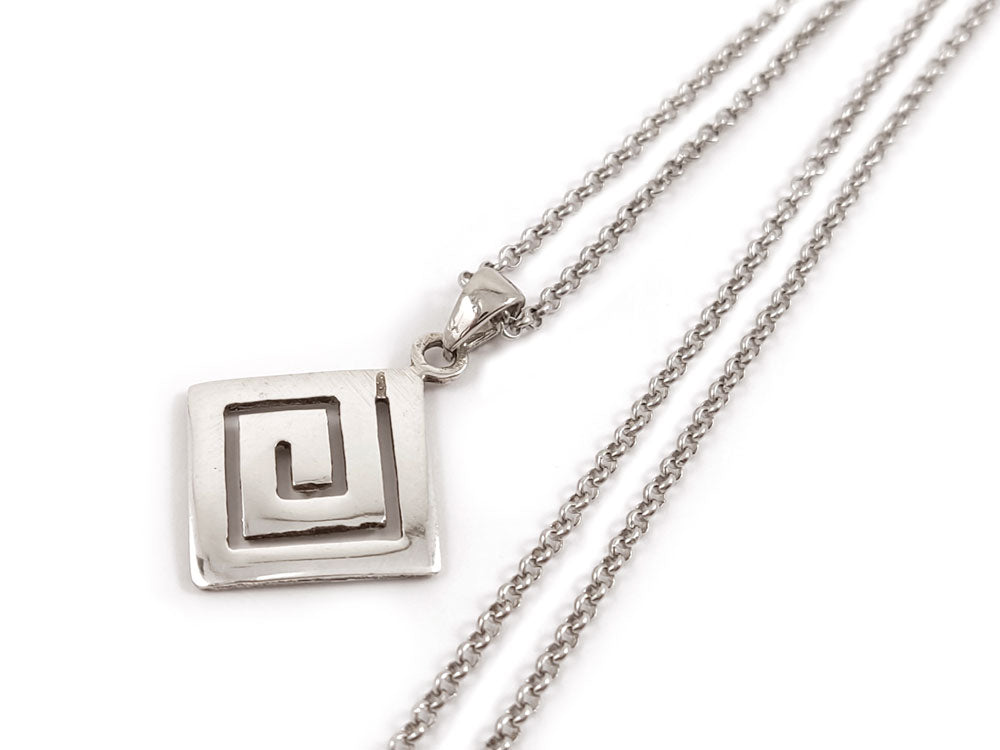 Greek Key Meander Sterling Silver Necklace – A sterling silver 925 pendant with a classic Greek Key design, measuring 16 x 16 mm (0.62 x 0.62 inches). It hangs from a 2 mm (0.007 inch) wide chain. Made in Greece with hallmark 925, this necklace offers free worldwide shipping.

