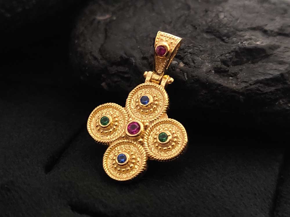 Close-up of gold-plated Sterling Silver 925 Byzantine Cross pendant featuring vibrant multicolor cubic zirconia stones.
