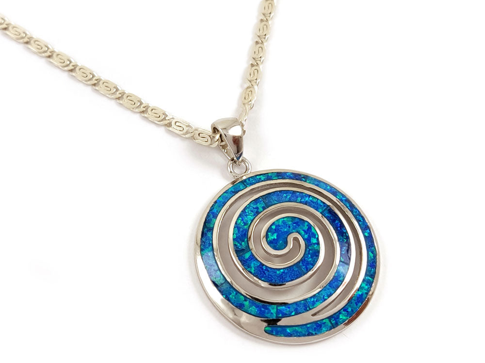 Greek spiral pendant with blue opal on Greek meander design silver chain .