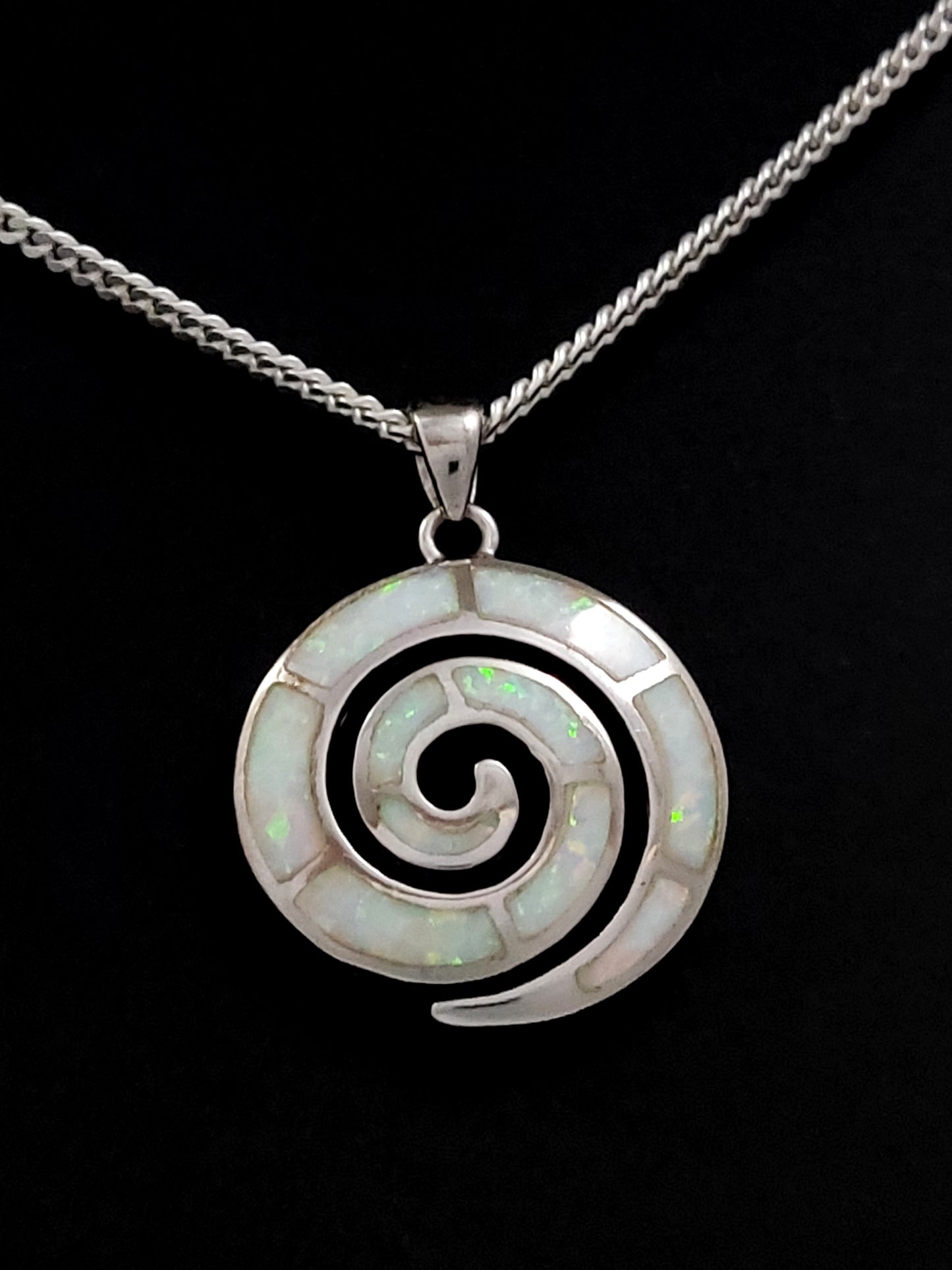 Greek silver spiral pendant with white opal stones measuring 23mm and with optional silver chain.