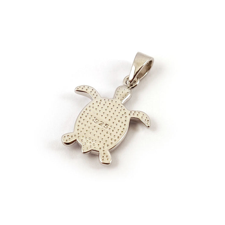 Silver turtle pendant on a white background