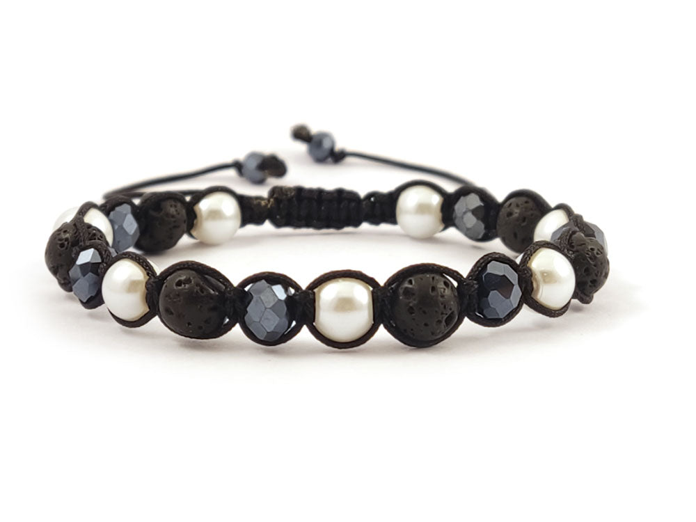 Spiritual black lava stone and pearl macrame bracelet on wrist