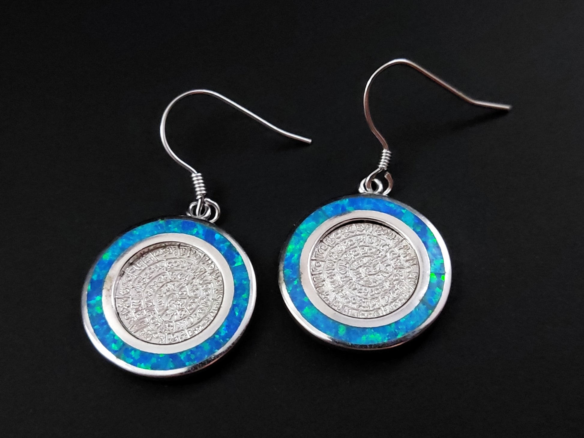 Greek silver earrings with the Phaistos Disc design with blue opal stones measuring 19mm in diameter.