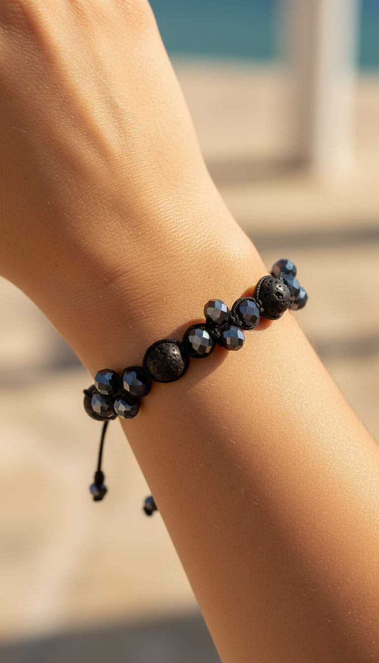 lava and black crystals handmade bracelet on female Greek model wrist.
