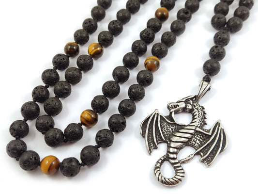 Close-up of handcrafted necklace with natural Lava Stones, Tiger’s Eye, and a stainless steel dragon pendant.
