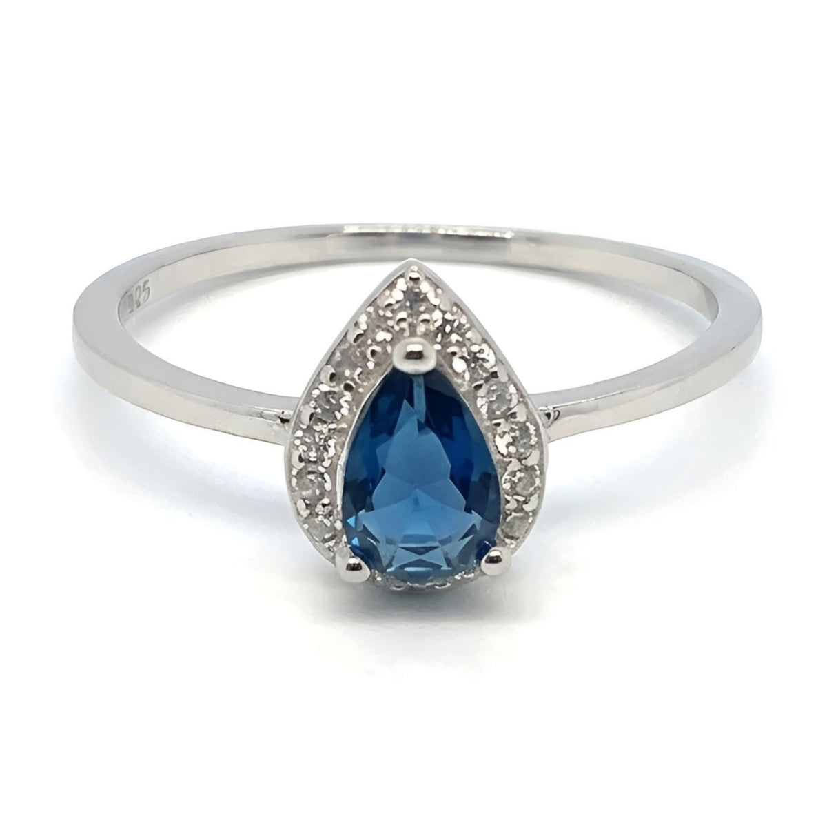 A sterling silver 925 ring featuring a pear-cut blue crystal stone surrounded by small clear accent stones, set on a plain white background.