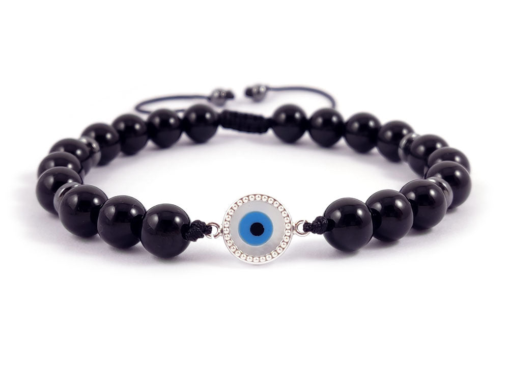 "Elegant bracelet crafted with Sterling Silver 925 and a 10mm Mother of Pearl Evil Eye charm, paired with 8mm natural onyx black stones. Features a slide clasp for secure wear, made in Greece, and ships worldwide for free."

