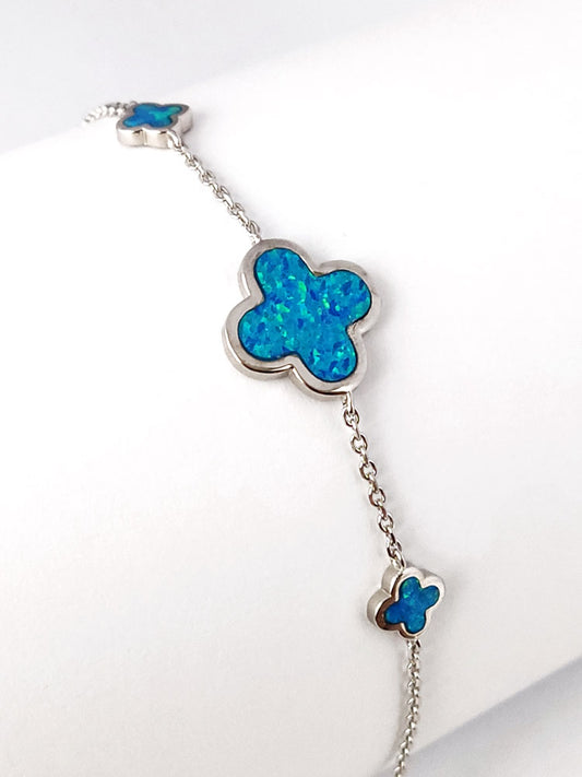 Sterling silver 925 bracelet featuring three blue opal crosses, 7–15 mm wide, with an adjustable 17–19 cm chain.