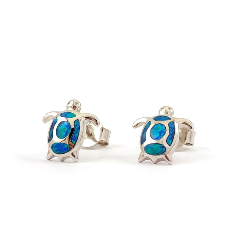 Turtle-shaped earrings with blue details on a white background