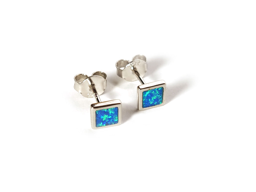 small earrings with square blue opal stones made of silver.