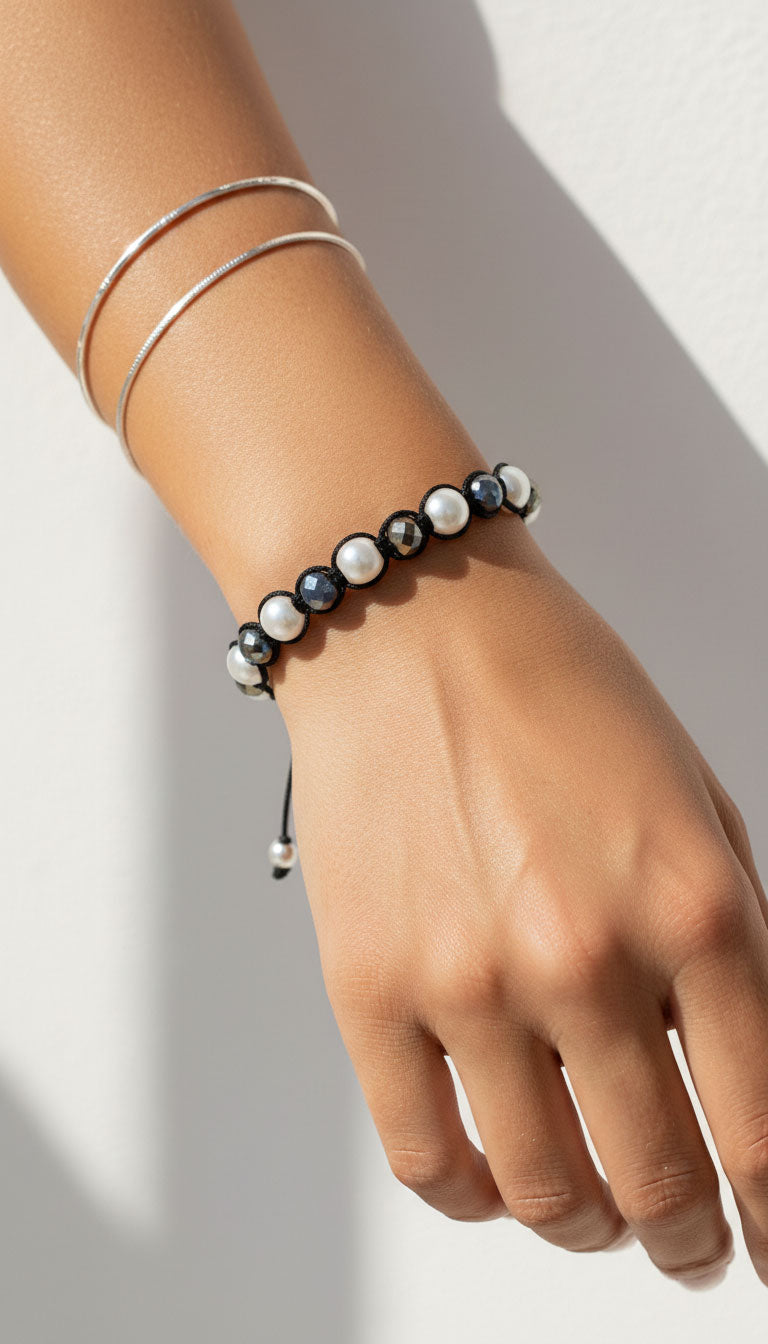 Handmade Greek bracelet with pearls and crystals on female Greek model.