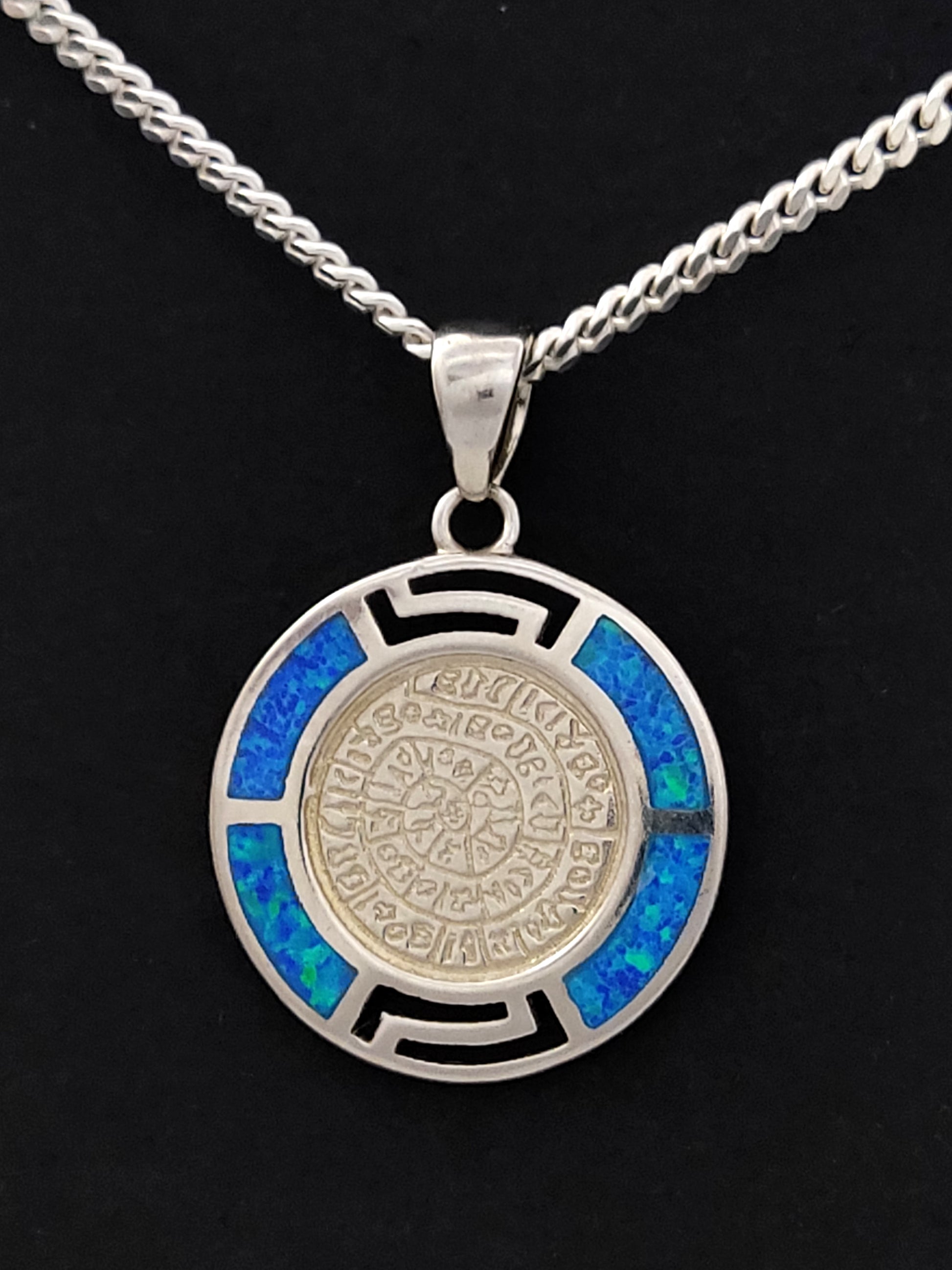 Phaistos Disc silver Greek pendant with blue opal stones measuring 19mm in width on a 2mm silver chain .