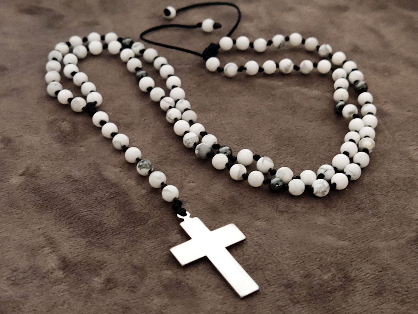 Discover Greek craftsmanship: Handmade Rosary Necklace with Natural White Howlite & Hematite Stones (4mm). Stainless Steel Cross (25 x 20 mm). Adjustable 55 - 70 cm length. Free Shipping.