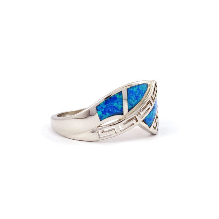 Silver ring with blue opal stones on a white background