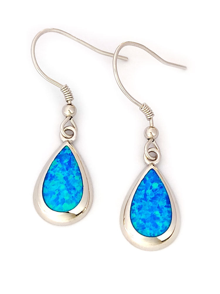 Beautiful silver earrings with blue opal stones on white background. Made in Greece by Sirioti Jewelry.