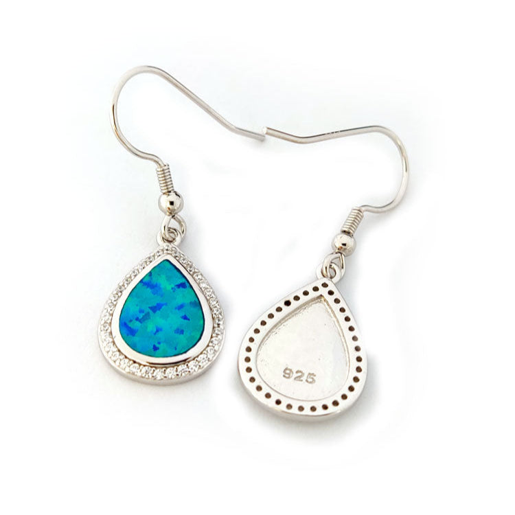 Teardrop-shaped opal earrings with silver hooks on a white background