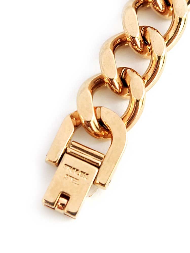 "Gold stainless steel bracelet worn on wrist – stylish unisex accessory"
