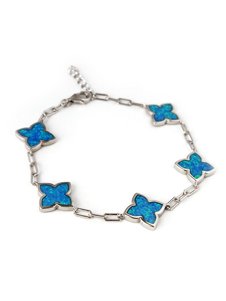 Adjustable silver bracelet with blue opal stones in cross shape from Greece.