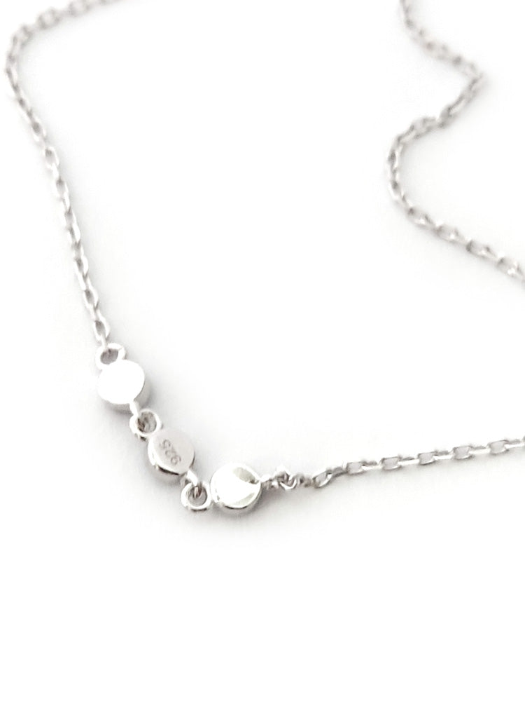 "Greek evil eye charm bracelet on wrist, minimalist 925 silver jewelry for protection"

