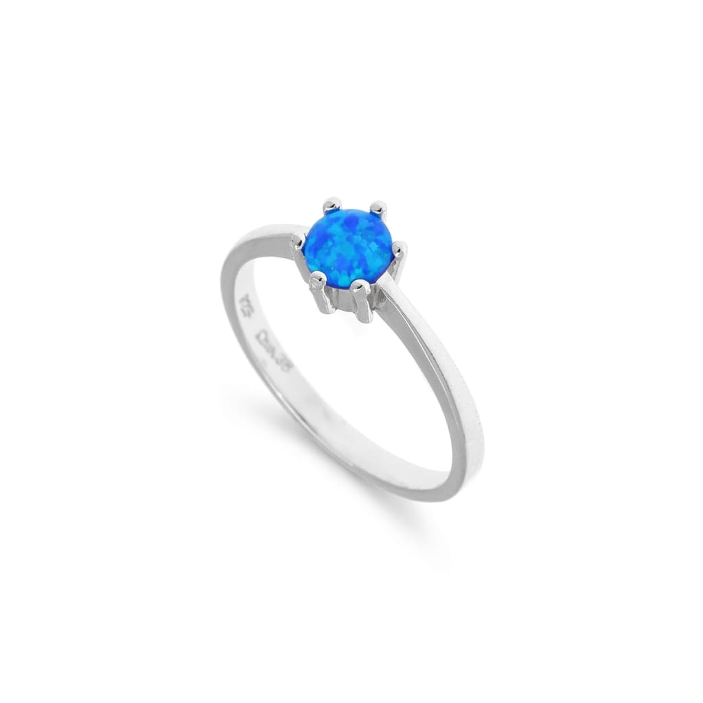 Silver ring with a blue opal stone on a white background