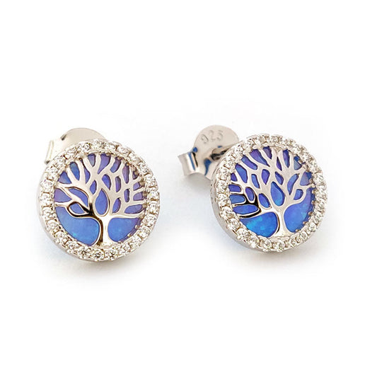Pair of silver earrings with blue opal and  tree of life design on a white background