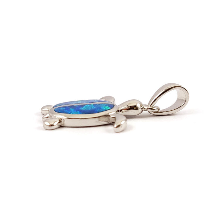 Silver pendant with a blue opal stone on a white background