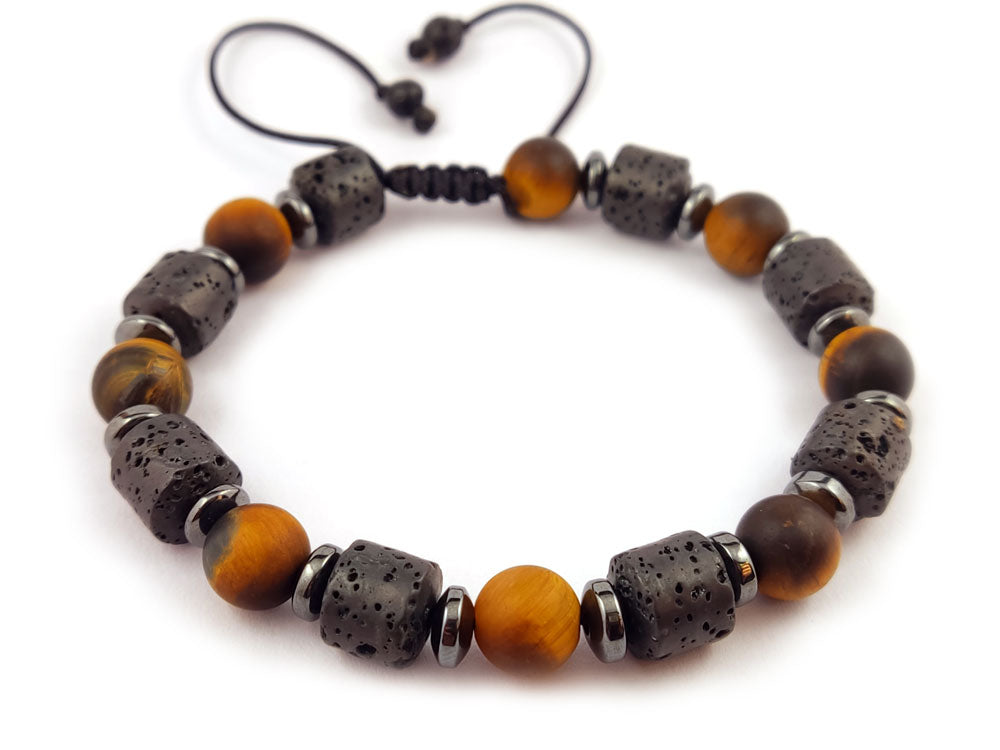 "Handmade Greek bracelet with lava and matte tiger's eye stones, adjustable from 18 to 23 cm, styled for everyday elegance."