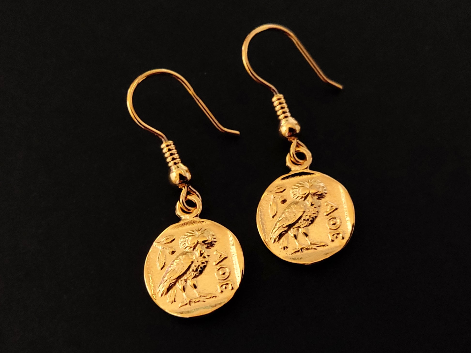 Greek silver 925 owl athena coin earrings with gold plated finish on black background