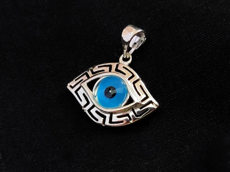 Silver pendant in evil eye shape and with the Greek Key.