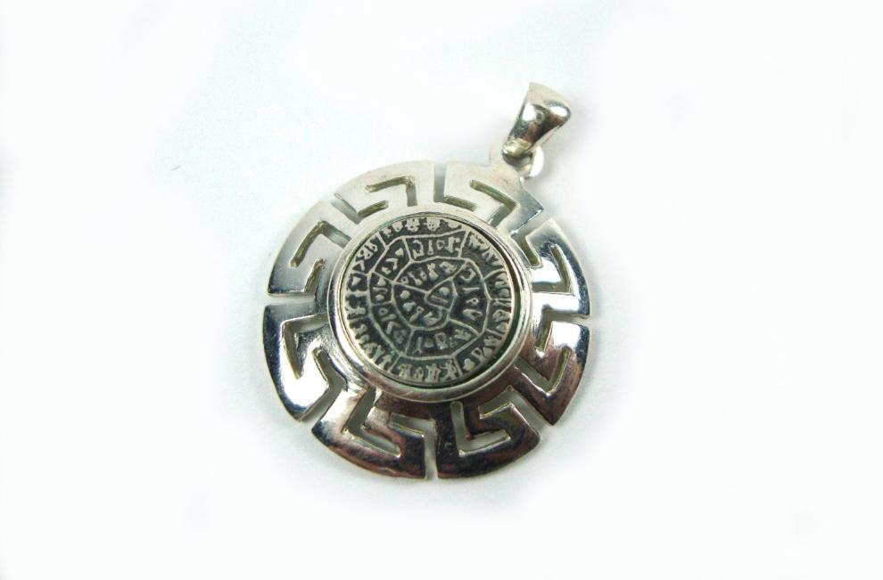 An elegant Sterling Silver 925 pendant featuring an Ancient Greek Minoan Phaistos Disc design, with a diameter of 26 mm (1.01 inches). Handcrafted in Greece, showcasing exquisite craftsmanship and cultural heritage.