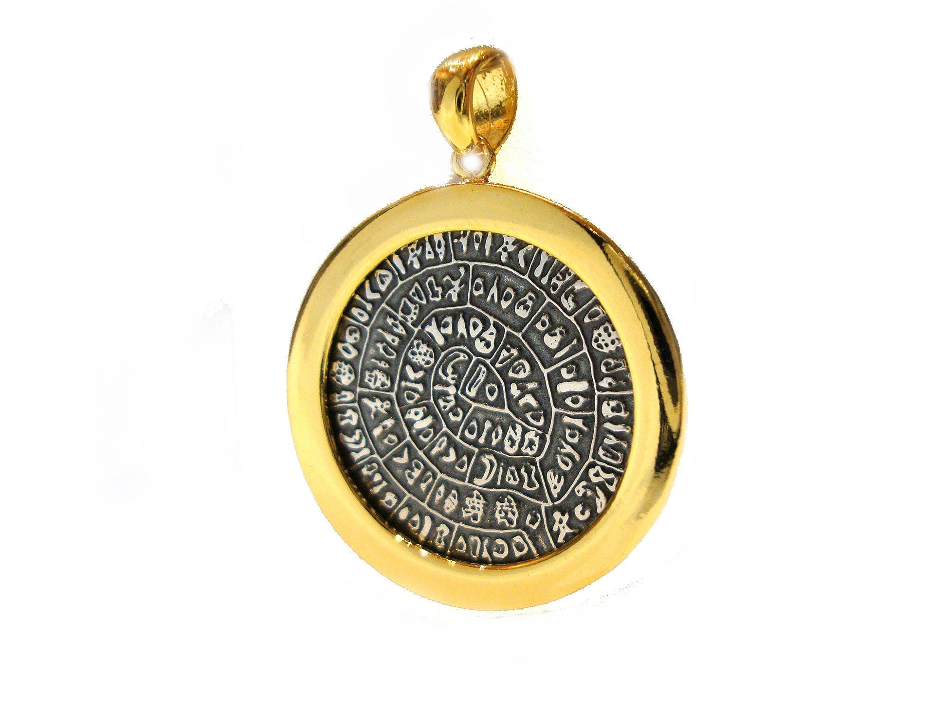 Greek silver pendant with the Phaistos Disc design in 2 colors , gold and silver , measuring 23mm.
