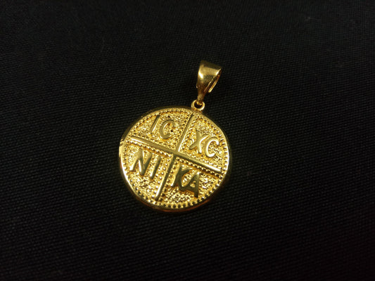Greek byzantine gold plated pendant called Konstantinato made of sterling silver 925 on black background.