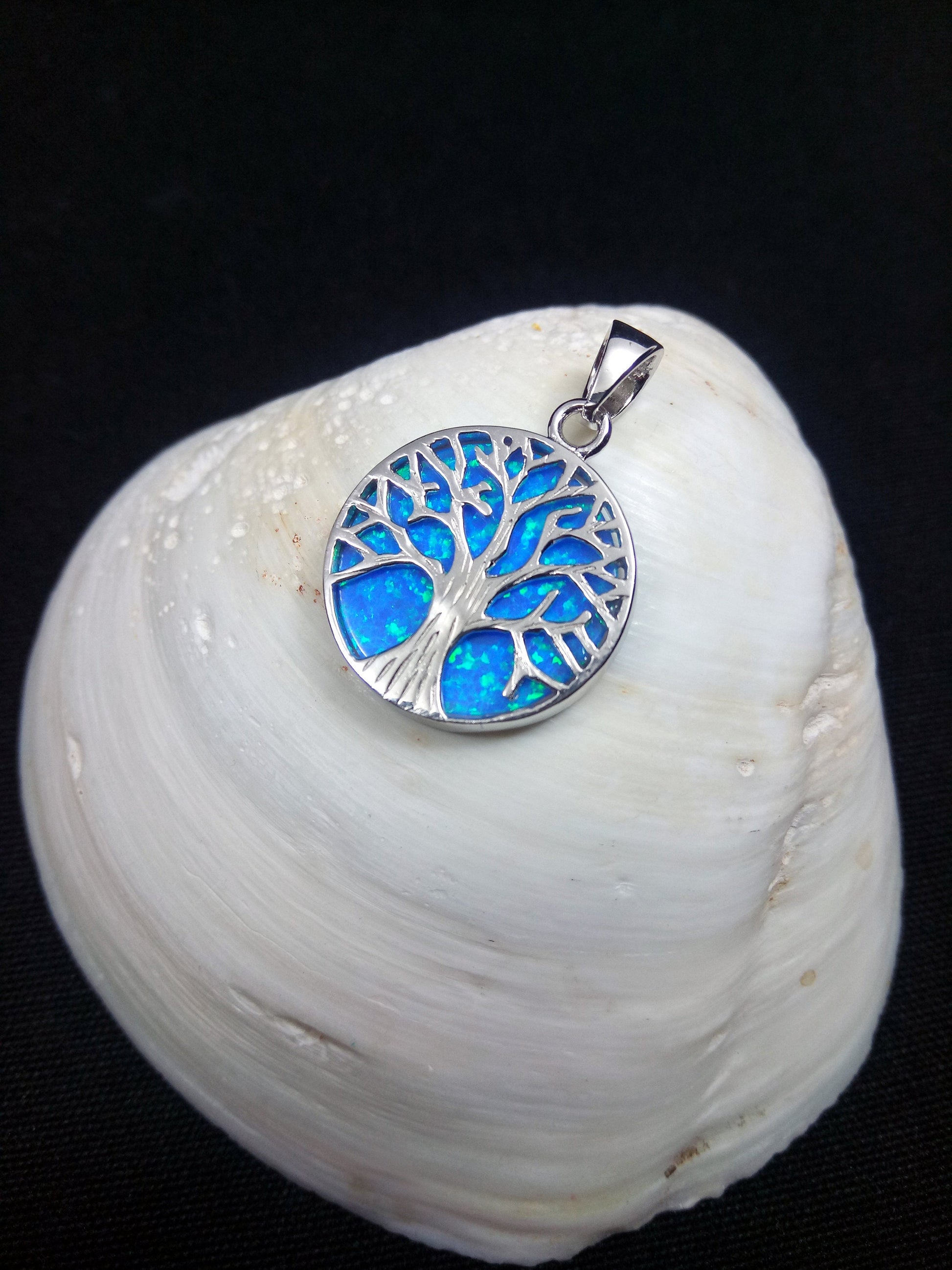 Sterling Silver 925 Blue Opal Tree of Life 18mm Pendant - A beautiful and unique pendant featuring a tree of life design made from sterling silver 925 and set with a stunning blue opal stone, measuring 18mm in diameter.