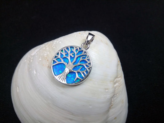 A sterling silver 925 pendant featuring a blue opal tree of life design, measuring 18mm in diameter.
