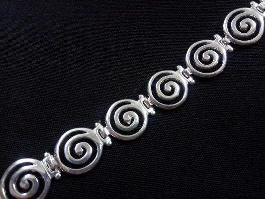 Close-up of Sterling Silver Ancient Greek Spiral Bracelet by Sirioti Jewelry - Symbol of Infinity and Greek Craftsmanship