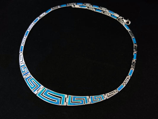 Image of a Sterling Silver 925 Fire Rainbow Blue Opal Necklace, showcasing its modern design and captivating opal centerpiece. Handcrafted in Greece, this necklace embodies the allure of Greek silver jewelry. Adjustable length, silver chain extension, and hallmark 925 ensure authenticity and quality craftsmanship. Free shipping included.