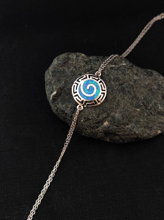 Silver Greek bracelet with blue opal stones and the infinity design from Greece.