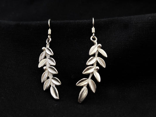 Sterling silver dangle earrings with intricate olive leaf design. Crafted in Greece. Symbol of peace and prosperity. Free shipping.